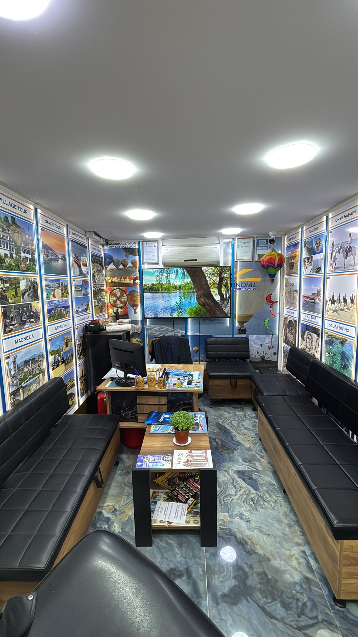 Sundial office interior with tour posters and seating